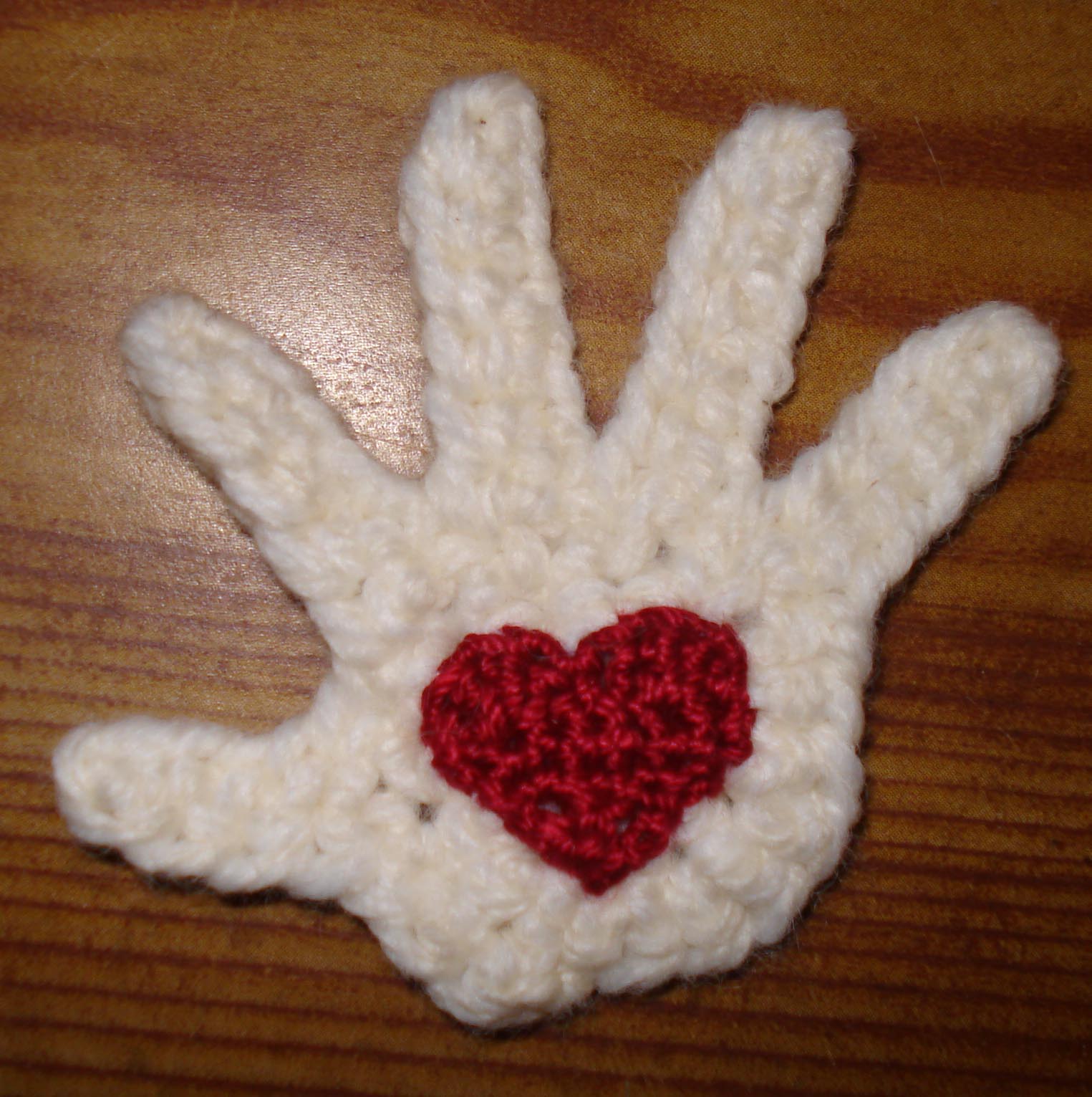 Crocheted hand with heart